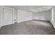 Unfinished basement features carpet, white walls, and a closet at 3813 Nowlin Nw Rd, Kennesaw, GA 30144