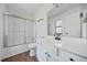 Bright bathroom features a shower-tub combo and updated vanity at 3813 Nowlin Nw Rd, Kennesaw, GA 30144