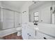 Bright bathroom features modern fixtures, shower, and wood-look flooring at 3813 Nowlin Nw Rd, Kennesaw, GA 30144