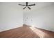 This bedroom features wood floors, a ceiling fan, and two closets at 3813 Nowlin Nw Rd, Kennesaw, GA 30144