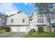 Charming two-story home featuring a well-manicured lawn, attached two-car garage and a mix of horizontal and vertical siding at 3813 Nowlin Nw Rd, Kennesaw, GA 30144