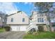 Inviting two-story home featuring a two-car garage, well-maintained lawn, and classic architectural design at 3813 Nowlin Nw Rd, Kennesaw, GA 30144