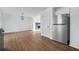 Kitchen with stainless refrigerator leading into living area with fireplace at 3813 Nowlin Nw Rd, Kennesaw, GA 30144