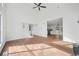 Spacious living room with high ceilings that seamlessly flows into the kitchen, perfect for modern living at 3813 Nowlin Nw Rd, Kennesaw, GA 30144