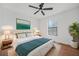 Nicely decorated bedroom with soft rug, modern artwork and bright window at 3813 Nowlin Nw Rd, Kennesaw, GA 30144