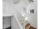 Bright staircase with white banister and wood-look treads at 3813 Nowlin Nw Rd, Kennesaw, GA 30144