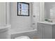 Bathroom featuring a shower-tub combination and vanity with white subway tile at 391 S Bend Se Ave, Atlanta, GA 30315