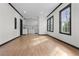 Spacious living room flows into kitchen with white cabinets and stainless appliances at 391 S Bend Se Ave, Atlanta, GA 30315