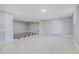 Finished basement area featuring tile flooring and neutral wall paint at 441 Village Way, Lawrenceville, GA 30046