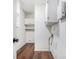 Laundry room featuring modern vinyl flooring, built-in shelving, and white cabinets at 441 Village Way, Lawrenceville, GA 30046