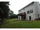 Large backyard featuring lush green grass and a second story deck, perfect for outdoor entertaining at 442 John Stewart Pl, Suwanee, GA 30024