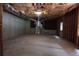 Unfinished basement with a concrete floor, exposed insulation, and utility hookups, ready for customization at 442 John Stewart Pl, Suwanee, GA 30024
