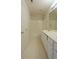 Bathroom featuring double sinks, a bathtub/shower combo, and neutral tile floors at 442 John Stewart Pl, Suwanee, GA 30024