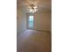 Bedroom with carpeted floors, ceiling fan, and a window providing natural light at 442 John Stewart Pl, Suwanee, GA 30024