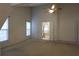 Neutral bedroom with carpet, a ceiling fan, and natural light from two windows at 442 John Stewart Pl, Suwanee, GA 30024