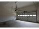 Spacious garage with an automatic door and ample room for parking and storage at 442 John Stewart Pl, Suwanee, GA 30024