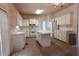 Kitchen with island, ample cabinetry, and stainless steel appliances at 442 John Stewart Pl, Suwanee, GA 30024