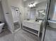 Bathroom featuring double vanities, a soaking tub under a stained glass window and a stand-up shower at 7910 Tintern Trce, Duluth, GA 30097