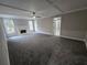 Spacious living room features a fireplace, coffered ceiling, and large windows with natural light at 7910 Tintern Trce, Duluth, GA 30097