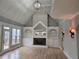 Cozy living room boasts hardwood floors, a fireplace, built-in shelving, and access to the deck at 7910 Tintern Trce, Duluth, GA 30097
