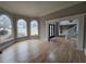 Spacious living room boasts hardwood floors, large windows, and elegant trim at 7910 Tintern Trce, Duluth, GA 30097