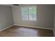Bedroom with ceiling fan and light wooden floor at 1947 Kensington High Sw St, Lilburn, GA 30047