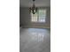 Dining room with tile flooring and a decorative chandelier at 1947 Kensington High Sw St, Lilburn, GA 30047