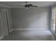 Living room featuring tile flooring, ceiling fan and natural light at 1947 Kensington High Sw St, Lilburn, GA 30047