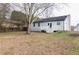 Spacious backyard featuring a small deck, grassy area and privacy fence at 2172 Red Rose Ln, Loganville, GA 30052