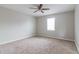 Comfortable bedroom with carpet flooring, a ceiling fan, and natural light at 2172 Red Rose Ln, Loganville, GA 30052