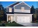 Charming two-story home featuring a brick facade, attached two-car garage, and inviting front entrance at 2766 Aralynn Way, College Park, GA 30337