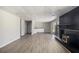 Finished basement features vinyl floors, black fireplace, and sliding door to backyard at 2830 Jodeco Dr, Jonesboro, GA 30236