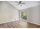 Bright bedroom features hardwood floors, a large window, and neutral color walls at 2830 Jodeco Dr, Jonesboro, GA 30236