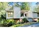 Charming two-story home with red brick facade, mature trees, and a lovely deck at 2830 Jodeco Dr, Jonesboro, GA 30236