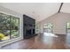 A bright living room with dark fireplace, hardwood floors, and an abundance of natural light at 2830 Jodeco Dr, Jonesboro, GA 30236