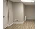 View of a basement featuring hard wood floors and neutral paint at 409 Arbor Ridge Dr, Stone Mountain, GA 30087