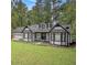 Charming two-story home with white siding, black trim, and a well-manicured front yard at 4902 Cedar Se Ct, Conyers, GA 30094