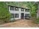 Charming two-story home with brick facade, black trim, and landscaped front yard at 3333 Devaughn Ne Dr, Marietta, GA 30066