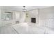 Bright living room featuring a tiled fireplace, modern light fixture, and neutral paint at 3333 Devaughn Ne Dr, Marietta, GA 30066