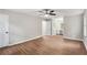 Spacious main bedroom with wood floors, ceiling fan, and en-suite bathroom at 3333 Devaughn Ne Dr, Marietta, GA 30066