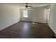Spacious bedroom featuring new flooring, neutral paint, ceiling fan, and natural light at 3417 Hollow Tree Dr, Decatur, GA 30034