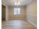 Bright dining room with wainscoting detail and modern light fixture at 3436 Lake Monroe Rd, Douglasville, GA 30135