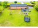 Expansive backyard featuring a fire pit, trampoline, patio with seating, hot tub, and play set for outdoor enjoyment at 4529 Lakeview Dr, Powder Springs, GA 30127