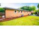 Brick home with a spacious backyard and patio at 4529 Lakeview Dr, Powder Springs, GA 30127