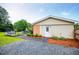 Backyard with patio, dining table, hot tub, and gravel at 4529 Lakeview Dr, Powder Springs, GA 30127