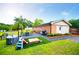 Well-maintained backyard with mature trees, playground, dining table, and patio at 4529 Lakeview Dr, Powder Springs, GA 30127