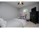 Inviting bedroom featuring soft gray walls, neutral carpet, and a functional layout with storage options at 4529 Lakeview Dr, Powder Springs, GA 30127