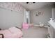 Charming bedroom with soft colors, playful decor, and comfortable space for  at 4529 Lakeview Dr, Powder Springs, GA 30127