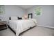 Cozy bedroom featuring neutral colors, soft carpet, and comfortable furnishings at 4529 Lakeview Dr, Powder Springs, GA 30127