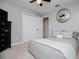 Comfortable bedroom with plush carpet, neutral decor, and a cozy bed with decorative pillows at 4529 Lakeview Dr, Powder Springs, GA 30127